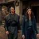 Lan Mondragoran (Daniel Henney) and Moiraine (Rosamund Pike) eyeball a town in Amazon Prime Video’s new series The Wheel Of Time